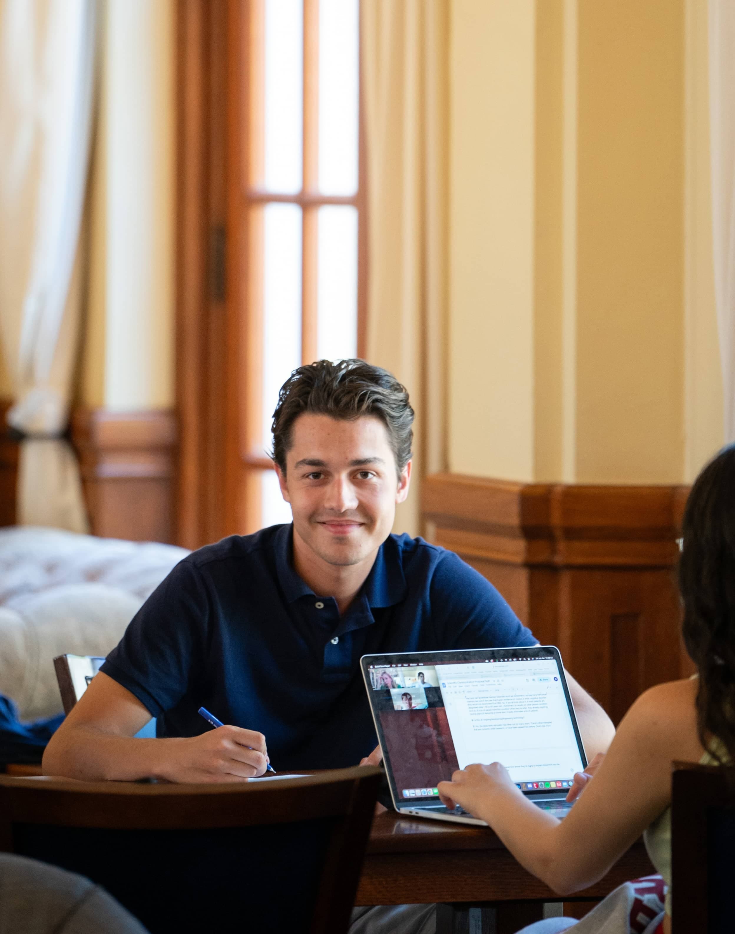 A student studies at a table.